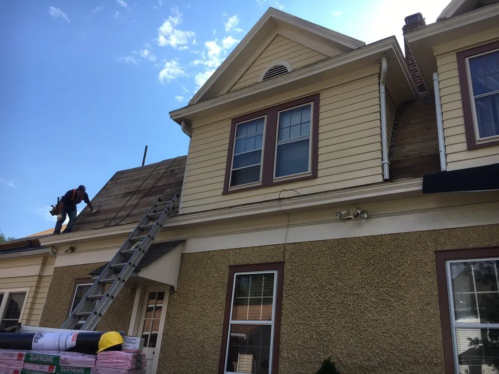 Slide of Four Brothers Roofing