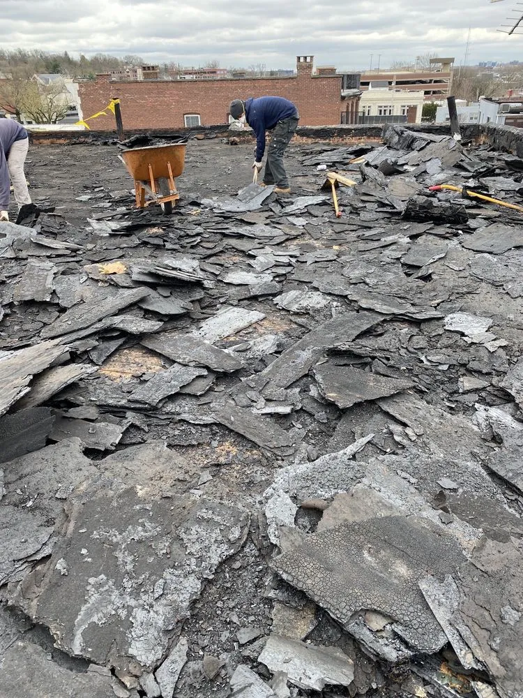 Slide of Four Brothers Roofing