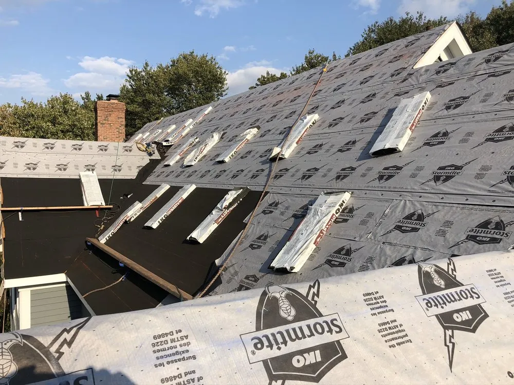 Slide of Four Brothers Roofing