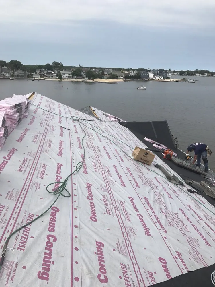 Slide of Four Brothers Roofing