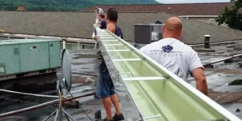 Slide of Four Season's Seamless Gutters & Construction