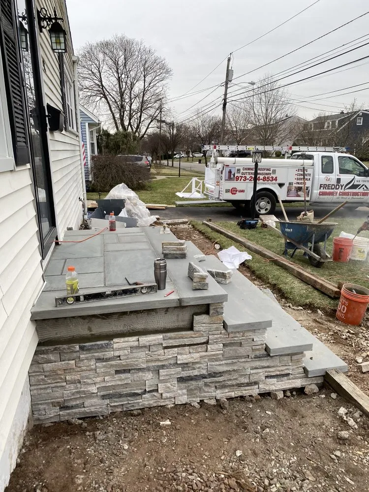 Slide of Freddy Chimney & Construction