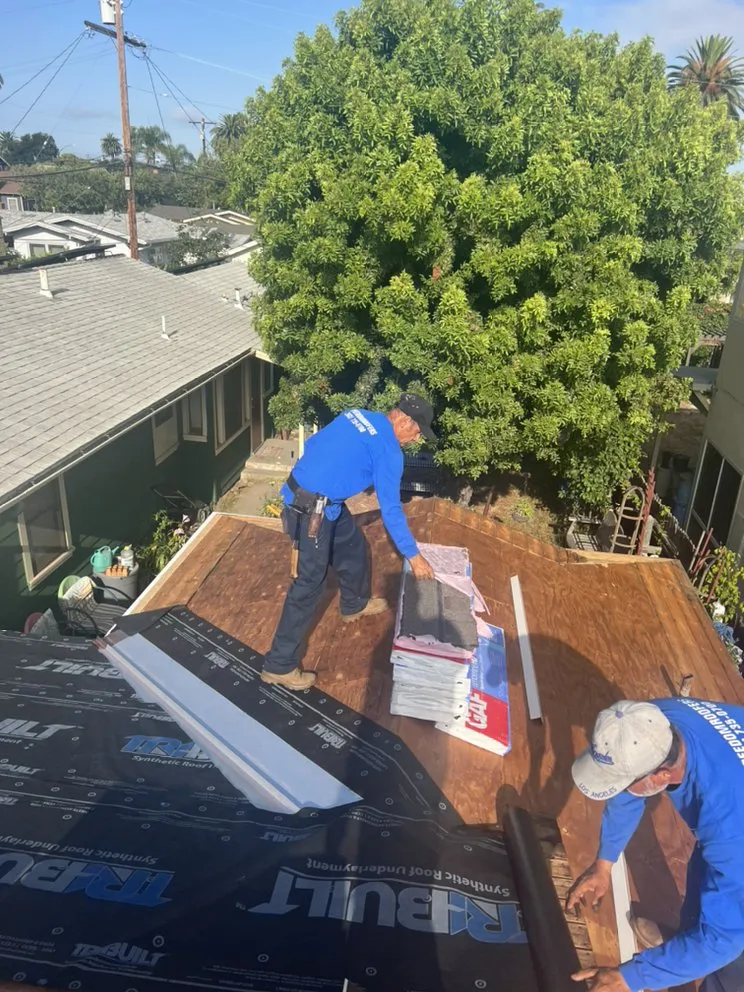 Slide of Freedom Roofing Company