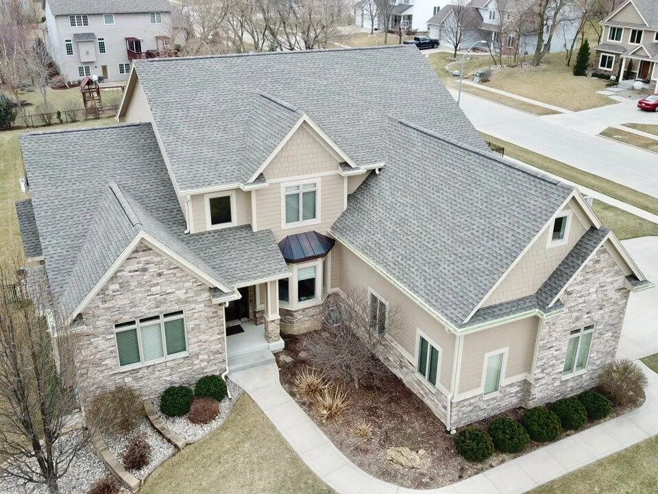 Emergency storm damage roof repair experts serving Cumming, IA - Genesis Roofing