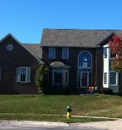 Local flat roof repair for residential properties in Cumming, IA by Genesis Roofing