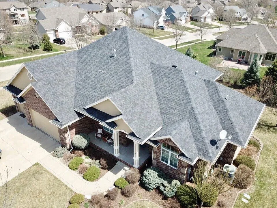 Licensed metal roofing installation after storm damage in Cumming, IA by Genesis Roofing