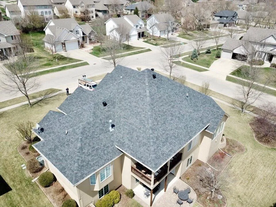 Emergency residential roofing service for homes in Cumming, IA by Genesis Roofing