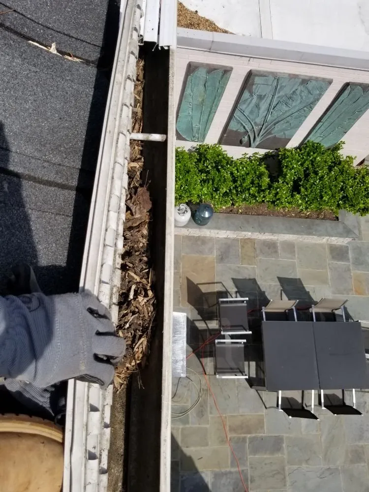 Slide of German Fuentes Gutter Cleaning