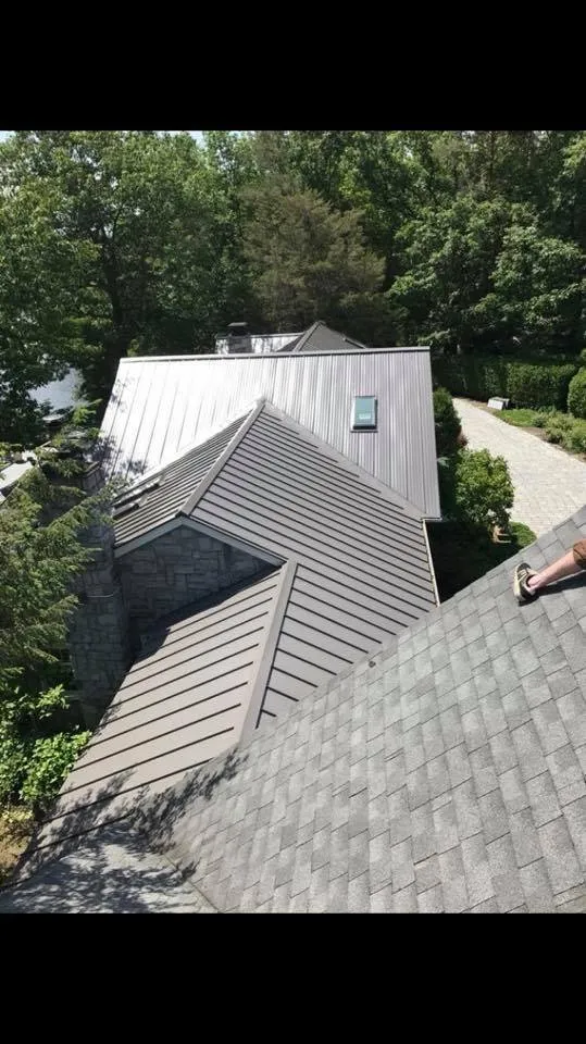 Local storm damage roof repair in Slingerlands, NY by Giles Construction