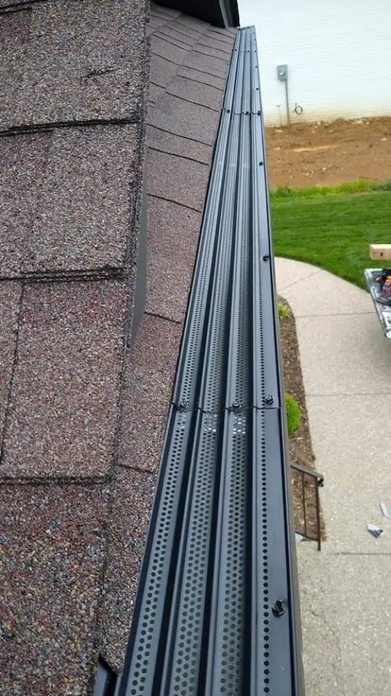 Slide of G/M Roofing & Gutter Topper