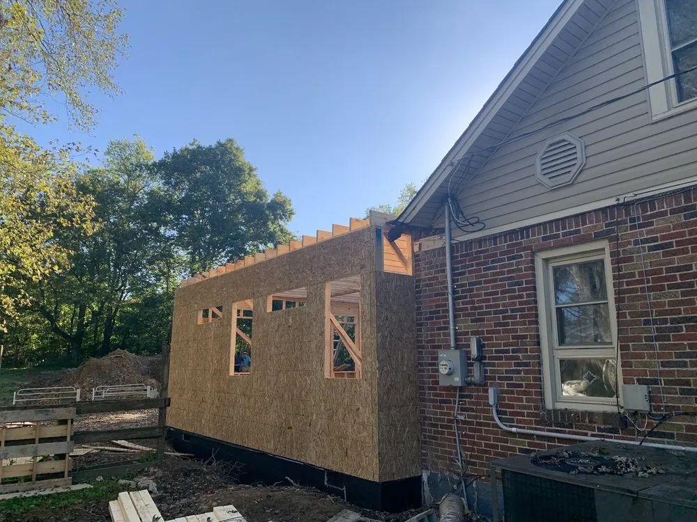 Slide of GM roofing and painting