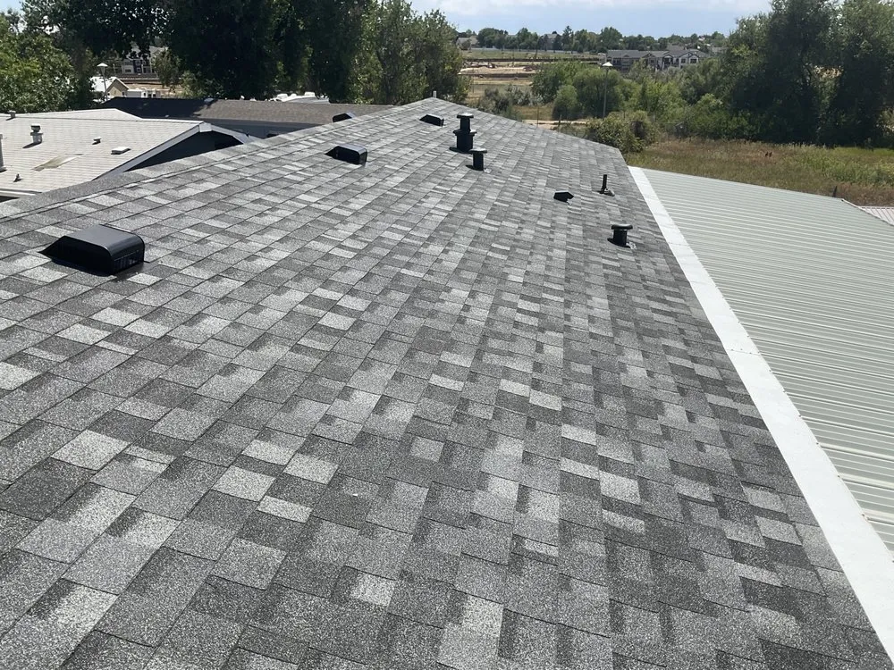 Slide of Golden Spike Roofing