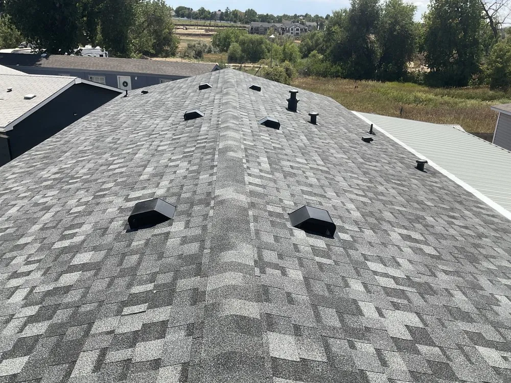 Slide of Golden Spike Roofing