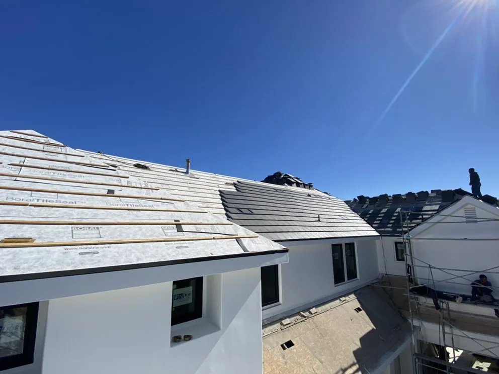 Slide of Goliath Roofing