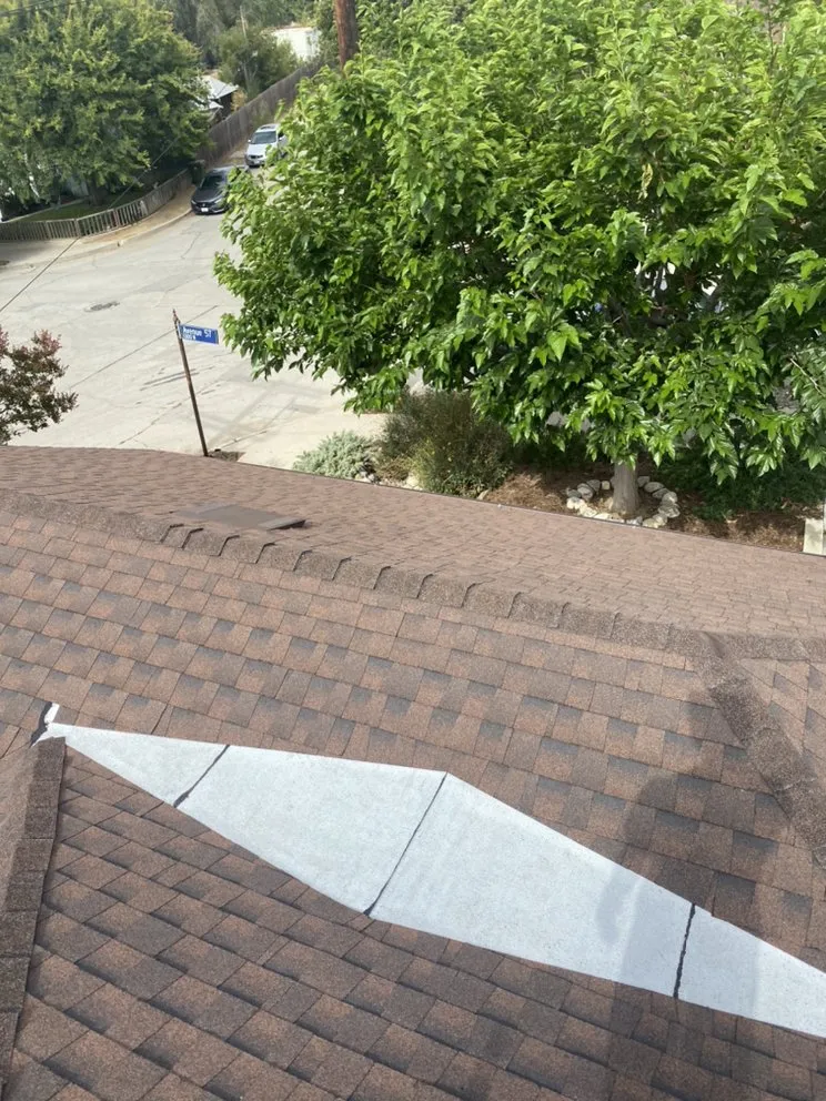 Slide of Goliath Roofing