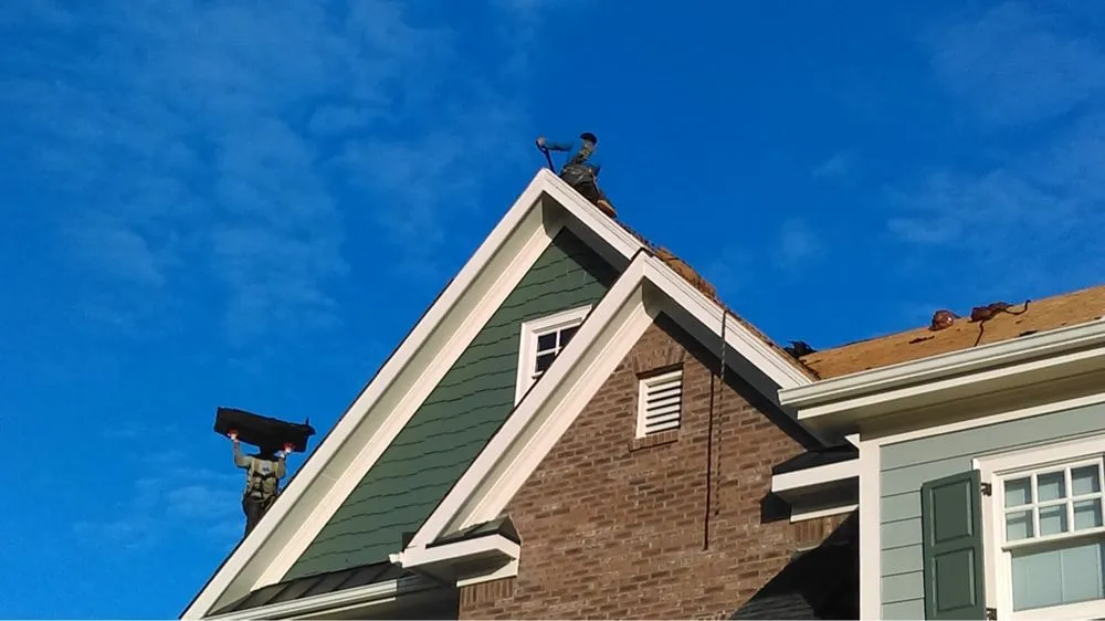 Slide of Goliath Roofing