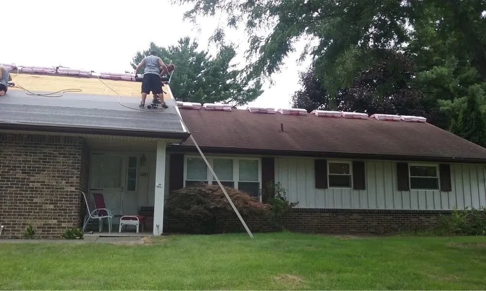 Slide of Goliath Roofing