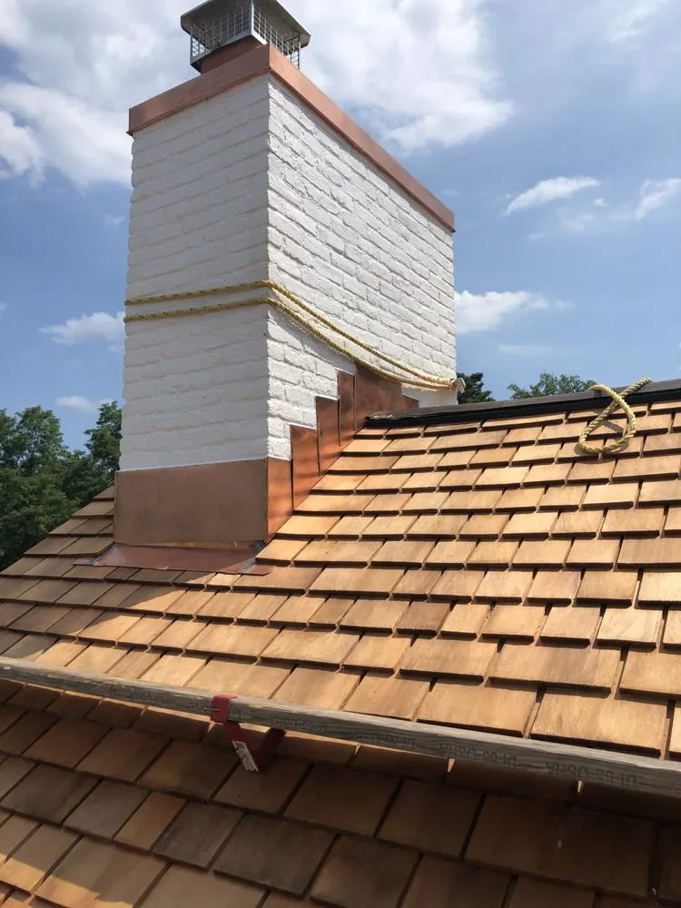 Licensed storm damage roof repair with free inspection in Point Lookout, NY by GPC Construction