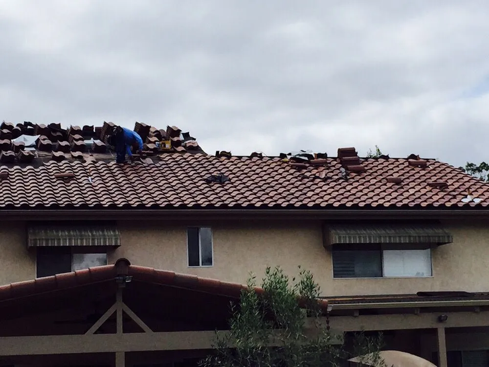 Slide of Grand Pros Roofing