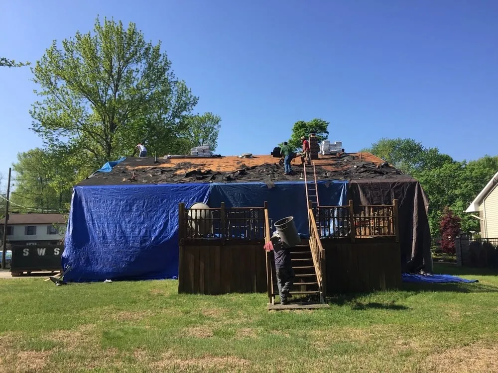 Slide of Green Apple Roofing