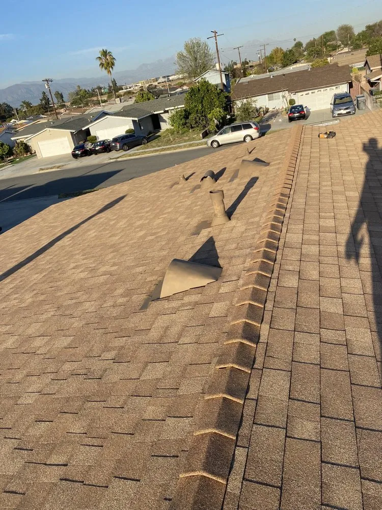 Slide of Green Ladder Roofing