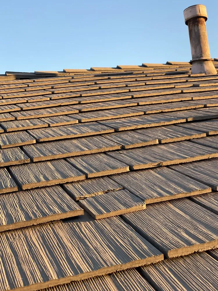 Slide of Green Ladder Roofing