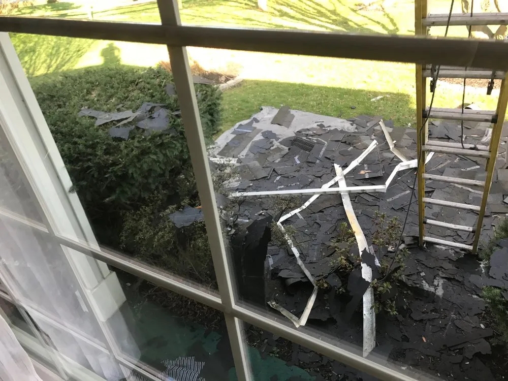 Emergency storm damage roof repair in Holmes, PA by Green Star Exteriors