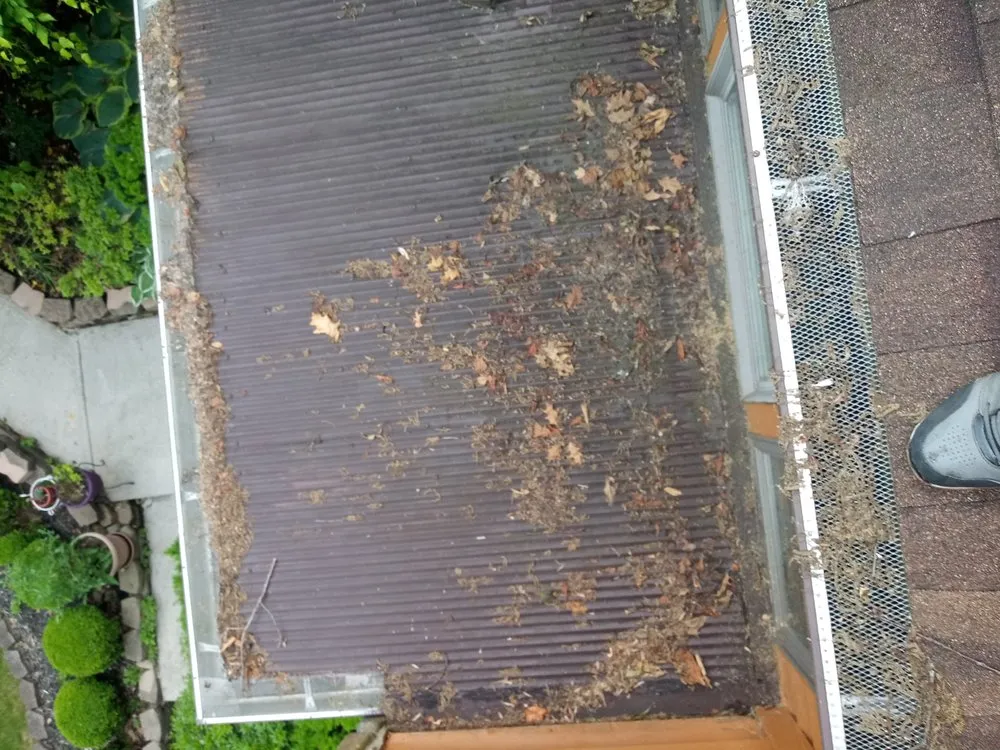 Slide of Greeno's roofing