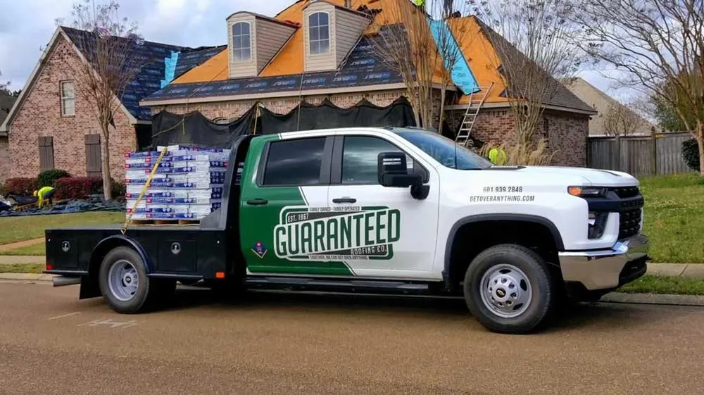 Slide of Guaranteed Roofing Company