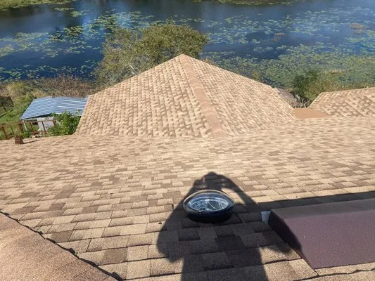 Guimoly Roofing & Contracting Logo