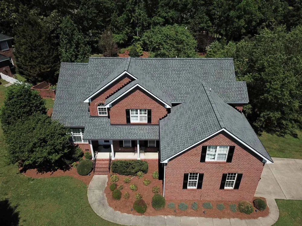 Slide of Guru Roofing Companies