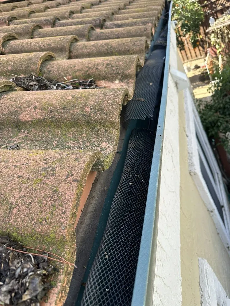 Slide of Gutter Guys Cleaning
