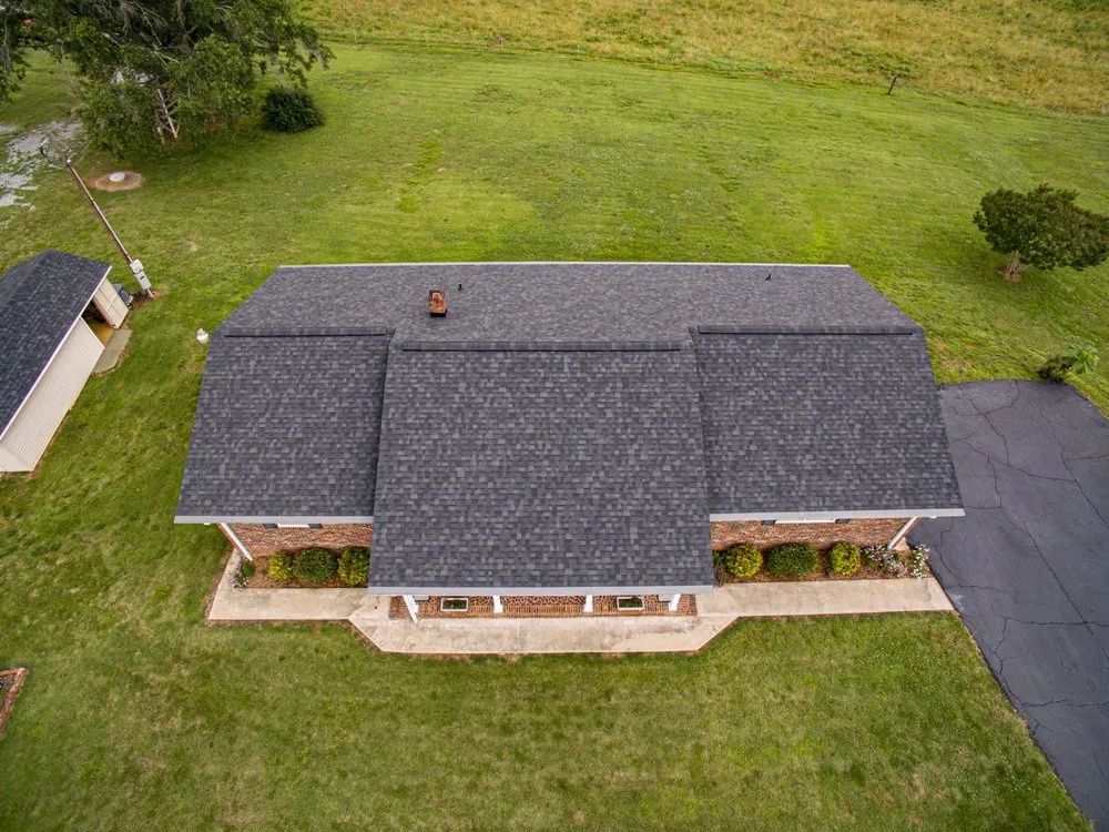 Slide of Guy Roofing