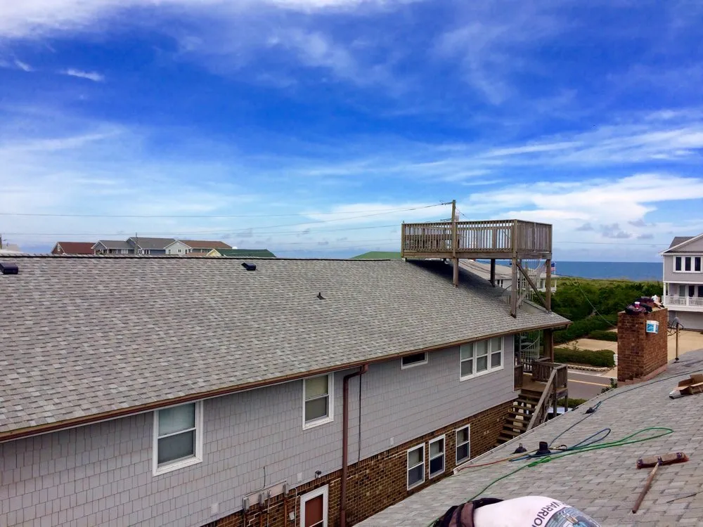 Slide of Hallman Roofing