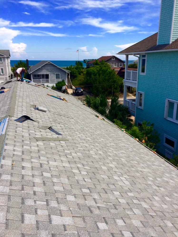 Slide of Hallman Roofing