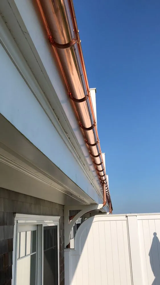 Slide of Hamptons Gutters Corp