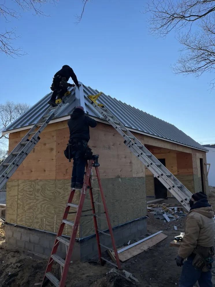 Slide of Hamptons Gutters Corp