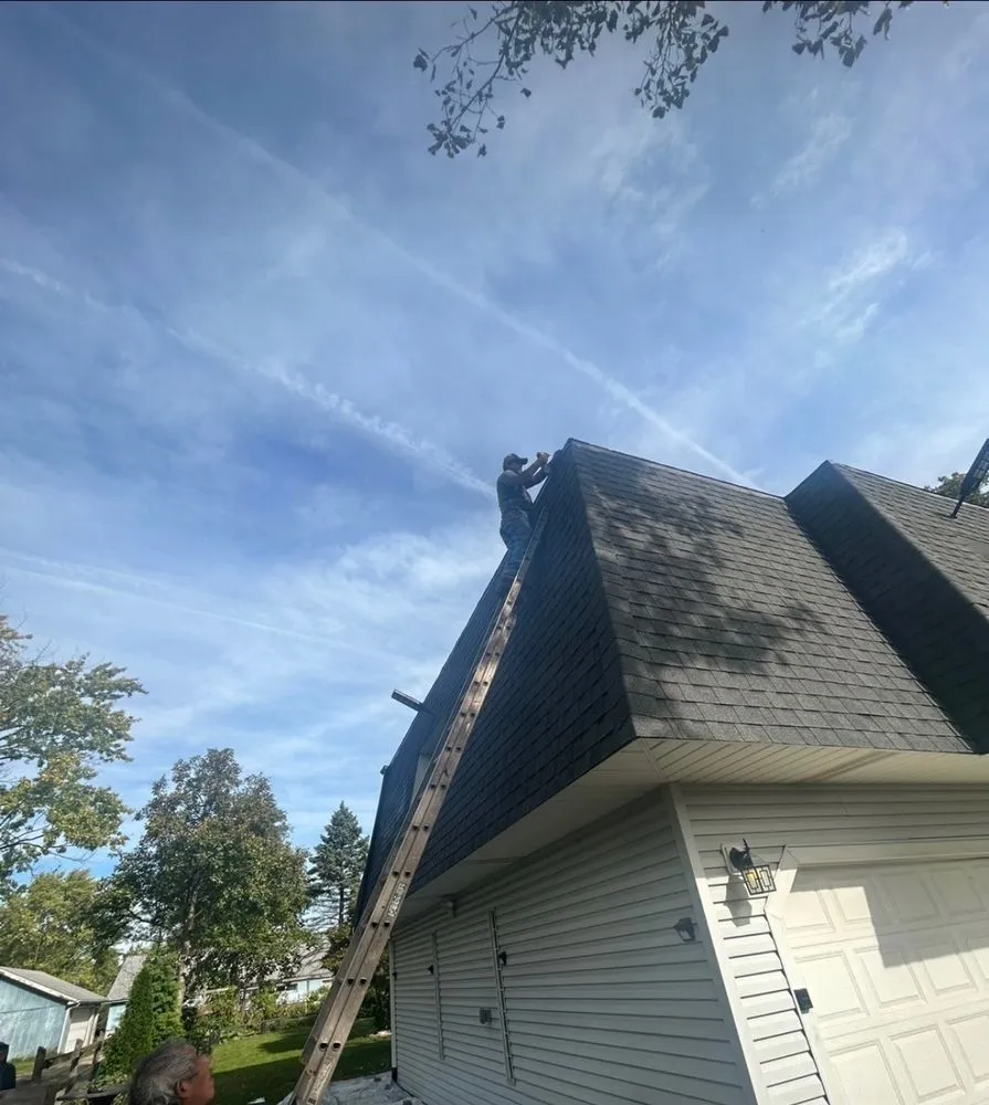 Slide of Harlem Roofing