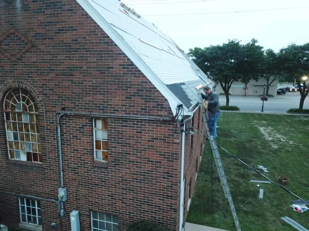 Professional storm damage roof repair after storm damage across Six Lakes, MI - Harner Roofing and Construction