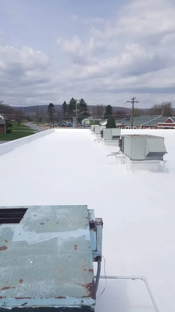 Emergency flat roof repair for homes in New Paris, PA by Harris Roofing