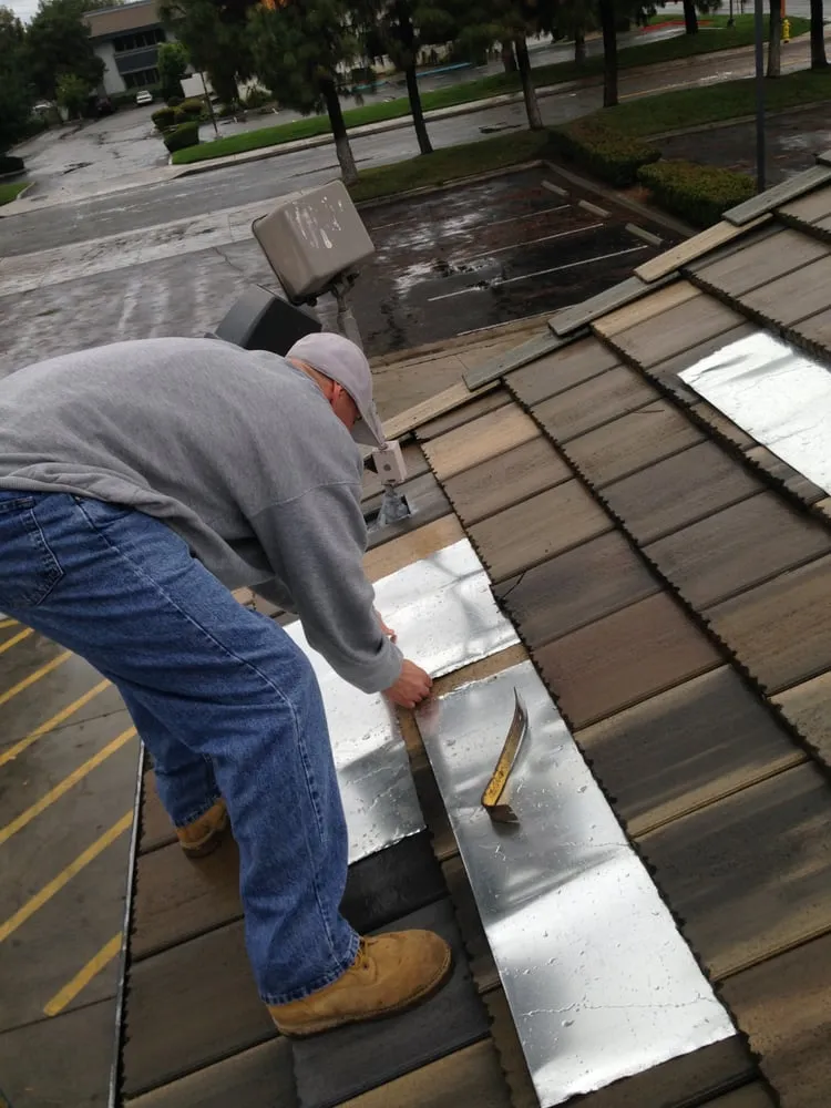 Slide of Hector's Roofing