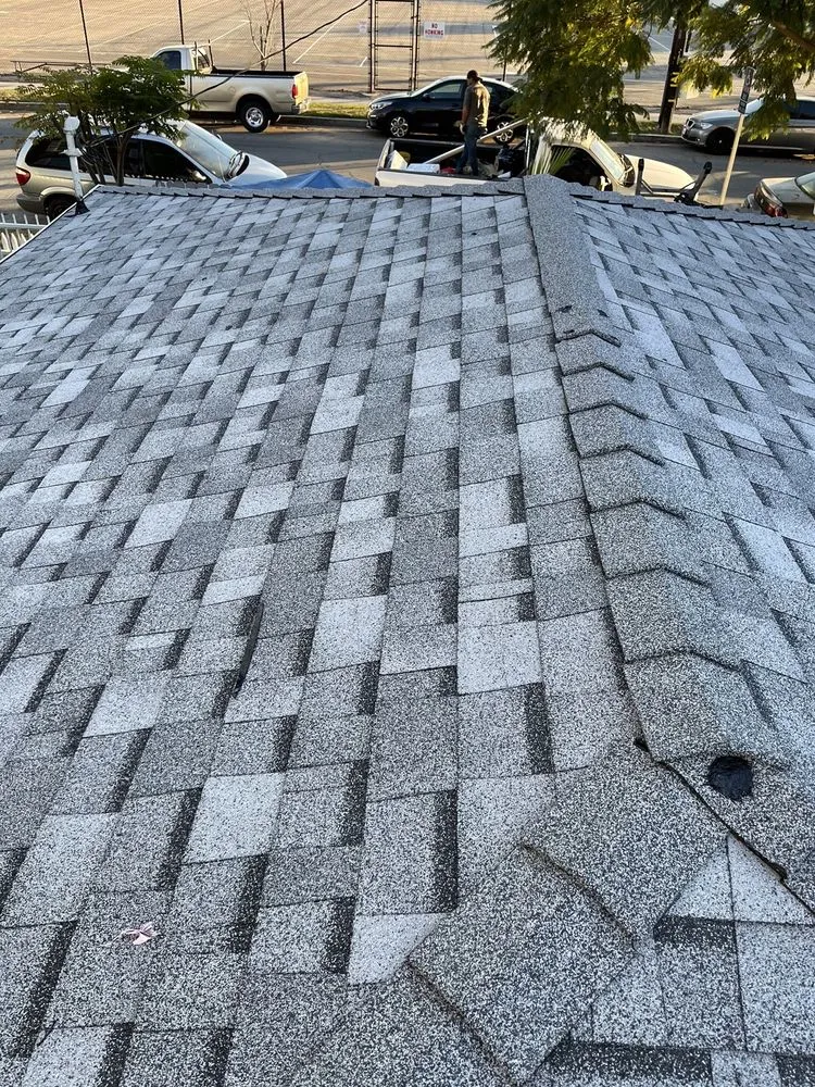 Slide of Hector's Roofing Quality Work