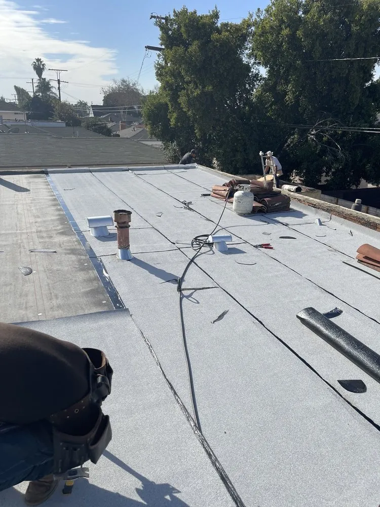 Slide of Hector's Roofing Quality Work