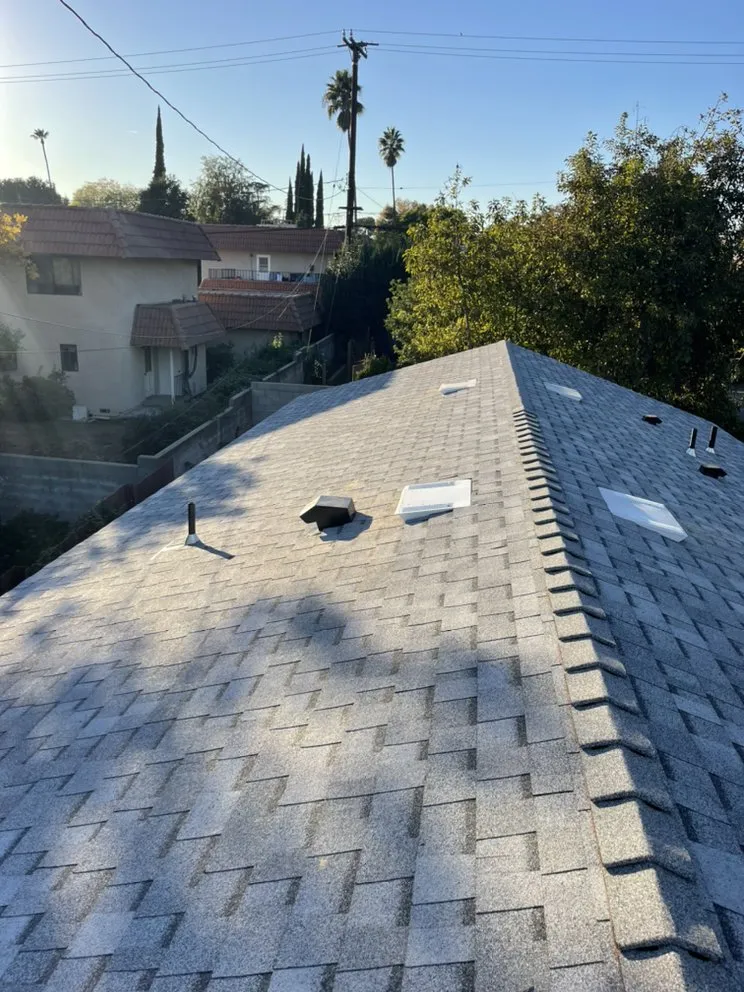 Slide of Hector's Roofing Quality Work