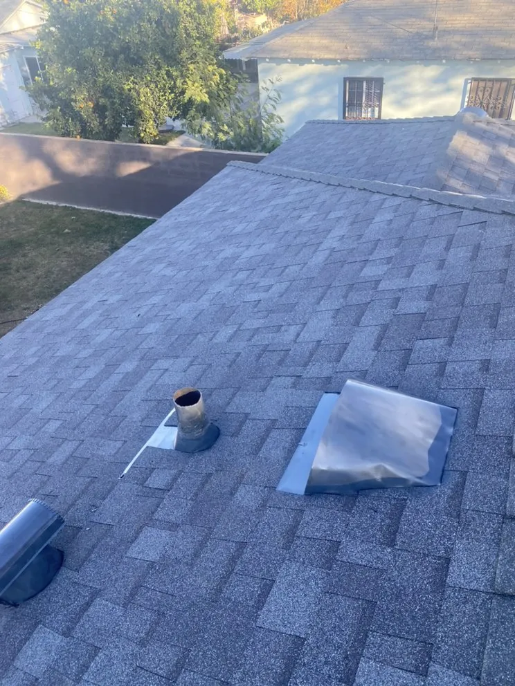 Slide of Hector's Roofing Quality Work