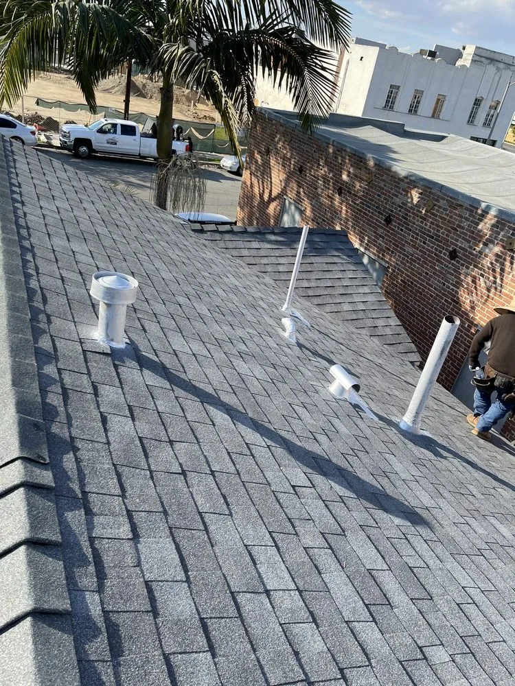 Slide of Hector's Roofing Quality Work