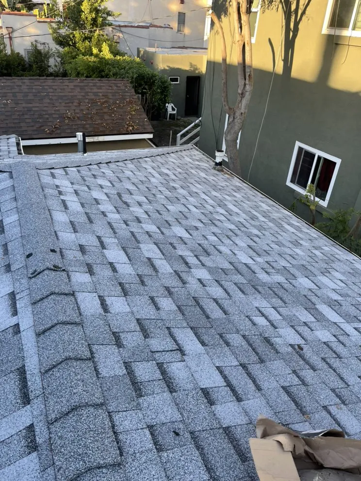 Slide of Hector's Roofing Quality Work