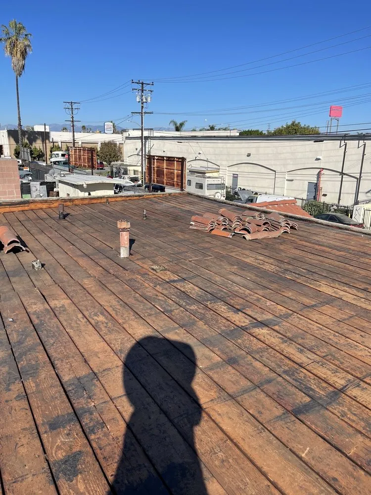 Slide of Hector's Roofing Quality Work