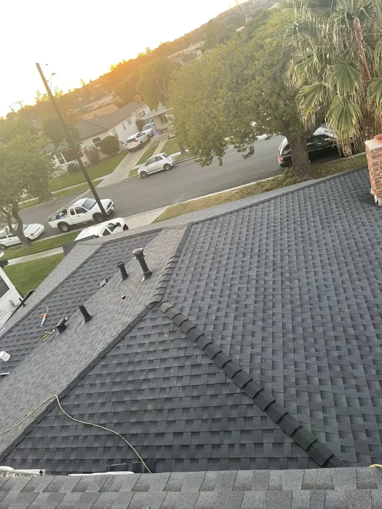 Slide of Hector's Roofing Quality Work