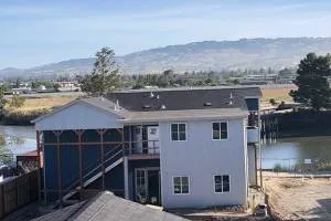 Slide of Henris Roofing